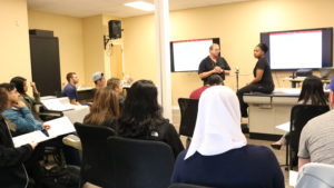 Students attending a Dr. Penney, MD / Provost lecture at Atlanta facility.